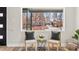 Living room with a large window, seating area, and view of the exterior street at 2731 W 42Nd Ave, Denver, CO 80211