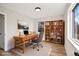 Functional home office with a desk, chair, and bookcase, creating a productive workspace at 2731 W 42Nd Ave, Denver, CO 80211