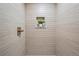 Spa-like shower with sleek tiling, a modern fixture and an integrated shelf for plants at 2731 W 42Nd Ave, Denver, CO 80211