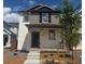 Charming two-story home featuring modern siding and a welcoming front porch at 2108 Chambers Rd, Brighton, CO 80601