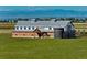 Majestic Farm-style home on vast acreage, featuring unique architecture and mountain views at 2108 Chambers Rd, Brighton, CO 80601