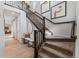 View of the staircase, leading to the open second floor at 2108 Chambers Rd, Brighton, CO 80601