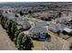 Wide aerial view of home with mature trees in a well-kept neighborhood on a sunny day at 5284 Taft Ct, Arvada, CO 80002