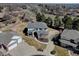 Aerial view of a well-maintained home with mature trees and a manicured lawn, showcasing curb appeal at 5284 Taft Ct, Arvada, CO 80002