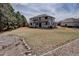 Expansive backyard with a patio and manicured lawn, perfect for outdoor entertaining at 5284 Taft Ct, Arvada, CO 80002