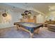 Finished basement featuring a pool table, wet bar and comfortable seating area perfect for entertaining at 5284 Taft Ct, Arvada, CO 80002