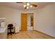 Neutral bedroom with wood floors features a ceiling fan and closet space at 5284 Taft Ct, Arvada, CO 80002