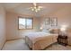 Cozy bedroom featuring large window, soft decor and natural light at 5284 Taft Ct, Arvada, CO 80002