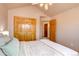 Neutral bedroom with closet and open bathroom at 5284 Taft Ct, Arvada, CO 80002