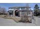Charming two-story home with a brick facade, arched entryway, and well-kept landscaping at 5284 Taft Ct, Arvada, CO 80002