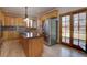 Modern kitchen with stainless steel appliances and a large island at 5284 Taft Ct, Arvada, CO 80002