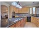 Bright kitchen with a large island, granite countertops, and stainless steel appliances at 5284 Taft Ct, Arvada, CO 80002