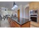 Spacious kitchen with an island cooktop and stainless steel appliances at 5284 Taft Ct, Arvada, CO 80002