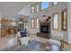 Open-concept living room features a fireplace and large windows, and is connected to the kitchen at 5284 Taft Ct, Arvada, CO 80002
