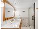 Elegant bathroom featuring marble counters, modern fixtures, and a glass-enclosed shower for a spa-like experience at 6211 E Orchard Dr, Greenwood Village, CO 80111