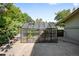 Backyard greenhouse structure, filled with plants, located next to patio with seating at 6211 E Orchard Dr, Greenwood Village, CO 80111