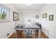 Bright home office with hardwood floors, neutral walls, and a modern desk setup at 6211 E Orchard Dr, Greenwood Village, CO 80111
