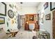 Charming home office with unique wall decor, wood-look floors, and antique wood furniture at 6211 E Orchard Dr, Greenwood Village, CO 80111