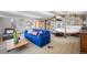 Large main bedroom with sitting area, hardwood floors, and decorative wall coverings at 6211 E Orchard Dr, Greenwood Village, CO 80111