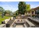 Outdoor patio with an outdoor kitchen, comfortable seating and a fire pit, perfect for entertaining at 6211 E Orchard Dr, Greenwood Village, CO 80111