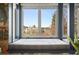 Close-up of cozy window seat framed by natural light and scenic views at 6211 E Orchard Dr, Greenwood Village, CO 80111