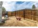 Large backyard with wooden fence, patio, and space for outdoor activities at 8180 Washington St # 126, Denver, CO 80229