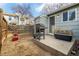 Private backyard featuring a patio, grill, and wooden fencing at 8180 Washington St # 126, Denver, CO 80229