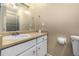 Bathroom showcasing a sink, large mirror, shower, and neutral walls at 8180 Washington St # 126, Denver, CO 80229