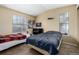 Bedroom showcasing carpet, two windows, neutral walls, and two beds at 8180 Washington St # 126, Denver, CO 80229