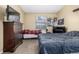 Bedroom showcasing carpet, a window, neutral walls, and two beds at 8180 Washington St # 126, Denver, CO 80229