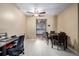 Dining area with ceiling fan and workspace, flows into the kitchen at 8180 Washington St # 126, Denver, CO 80229