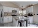 Modern kitchen features stainless steel appliances, granite countertops, and ample cabinet space at 2888 Deer Creek Trl, Highlands Ranch, CO 80129