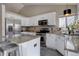 Bright kitchen features stainless steel appliances, granite countertops, and ample cabinet space at 2888 Deer Creek Trl, Highlands Ranch, CO 80129