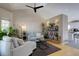 Bright living room with vaulted ceiling, stylish furnishings, and natural light at 2888 Deer Creek Trl, Highlands Ranch, CO 80129