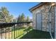 Balcony with views of landscaped grass and mature trees and a stone exterior at 2575 S Syracuse Way # M307, Denver, CO 80231