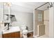 Contemporary bathroom with a tiled walk-in shower, wood-look flooring, and modern fixtures at 2575 S Syracuse Way # M307, Denver, CO 80231