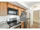 Kitchen with stainless steel appliances, ample cabinet space, and tile backsplash at 2575 S Syracuse Way # M307, Denver, CO 80231