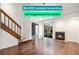 Inviting living room boasts a fireplace, wood floors, and a sliding glass door leading to the outside at 2575 S Syracuse Way # M307, Denver, CO 80231