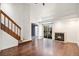 Bright living room features hardwood floors, vaulted ceilings, and a cozy fireplace at 2575 S Syracuse Way # M307, Denver, CO 80231