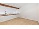 Empty loft space featuring an accent beam and carpeting at 2575 S Syracuse Way # M307, Denver, CO 80231