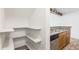 Walk-in pantry features open shelving and convenient access to the kitchen area at 2575 S Syracuse Way # M307, Denver, CO 80231