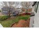 Aerial view of the backyard featuring a well-maintained lawn and stone patio at 6647 Lynx Cv, Lone Tree, CO 80124