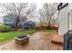 Outdoor space featuring a brick patio with fire pit and privacy fence, perfect for entertaining at 6647 Lynx Cv, Lone Tree, CO 80124
