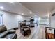 Finished basement area with neutral paint, chair seating and bright lighting at 6647 Lynx Cv, Lone Tree, CO 80124
