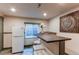 Basement wet bar, complete with a mini fridge and seating at 6647 Lynx Cv, Lone Tree, CO 80124