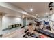 Spacious basement gym with laminate flooring and workout equipment at 6647 Lynx Cv, Lone Tree, CO 80124