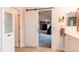 Modern bathroom with sliding door access to Primary suite and tile floors at 6647 Lynx Cv, Lone Tree, CO 80124