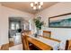 Dining room featuring hardwood floors, chandelier, and an open layout, perfect for entertaining at 6647 Lynx Cv, Lone Tree, CO 80124