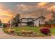Well-maintained two-story home with solar panels, attractive landscaping, and a lush lawn at 6647 Lynx Cv, Lone Tree, CO 80124