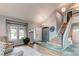 Inviting foyer boasts high ceilings, tile entryway, and a view of the staircase, complemented by stylish furnishings at 6647 Lynx Cv, Lone Tree, CO 80124
